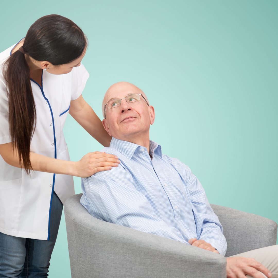 Smiling nurse and old senior man patient. Care for older people concept